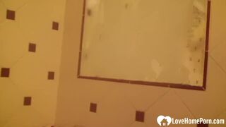 Showering brunette likes to finger her cunt